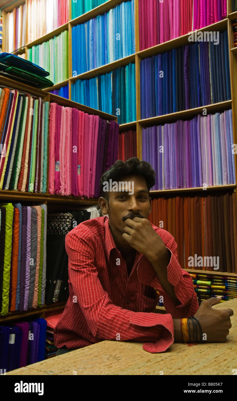 Man in a materials shop in Madurai in Tamil Nadu India Stock Photo Alamy