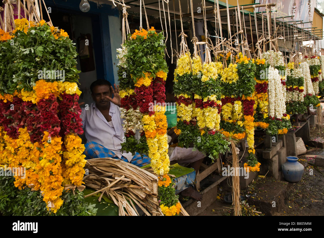 Flowermarket selling offering garlands in front of Shree Meenakshi Temple in Madurai in Tamil Nadu in India Stock Photo