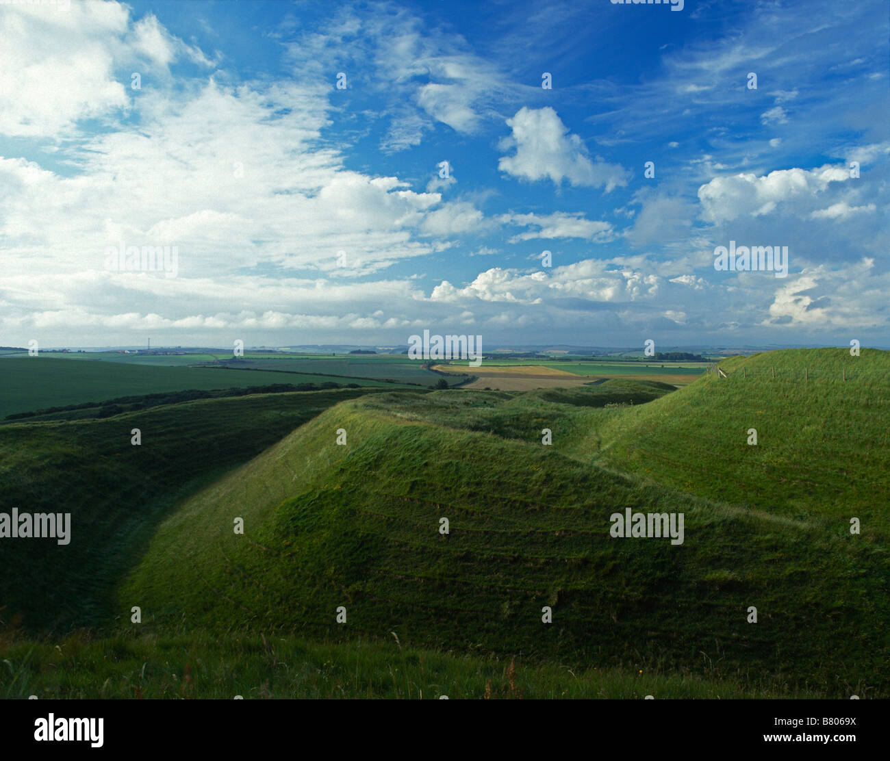 Ramparts and ditches at Maiden Castle, Dorchester, Dorset, UK. An Iron Age hill fort mainly built around 400 BC, it is the largest hill fort in Europe Stock Photo