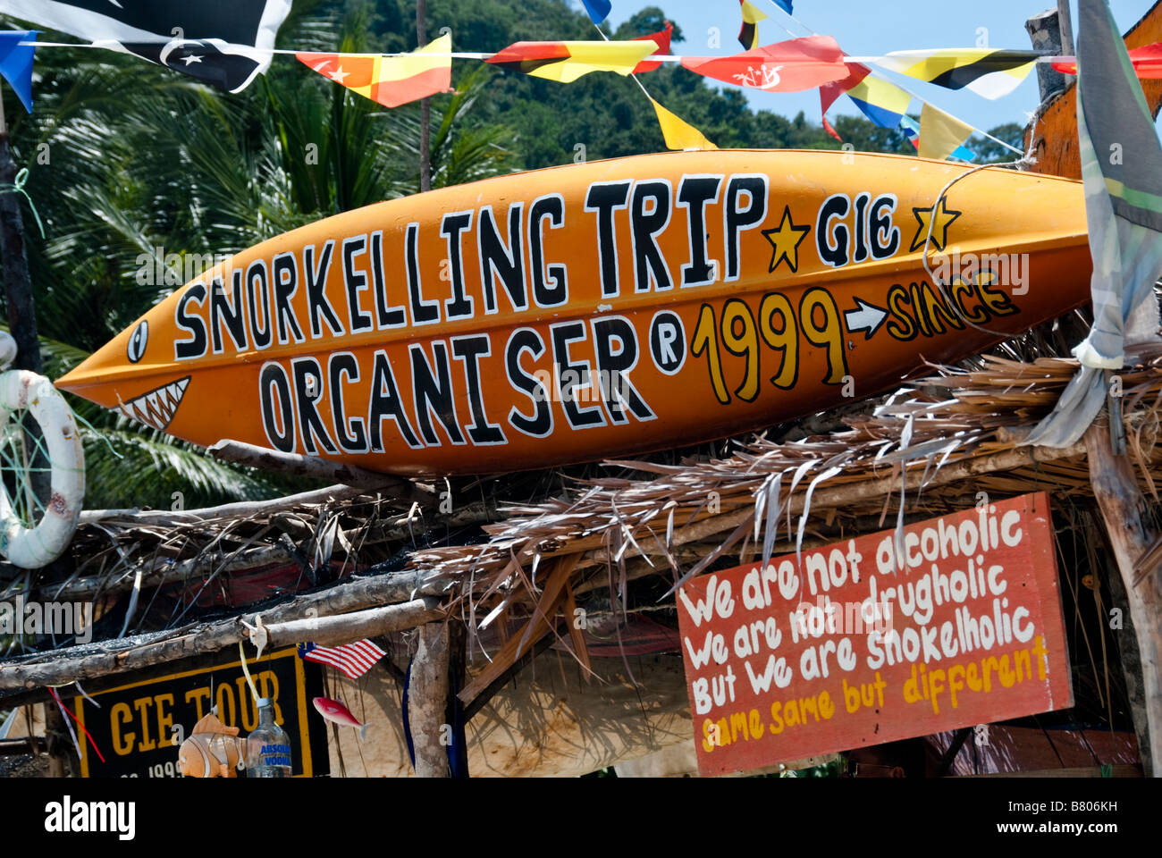 Surfboard advertising snorkeling trips from Long Beach on Perhentian Kecil, Malaysia Stock Photo