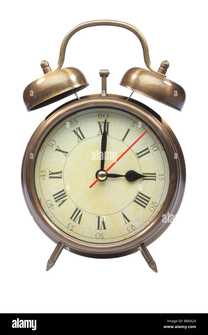 An old fashioned alarm clock at three o clock Stock Photo