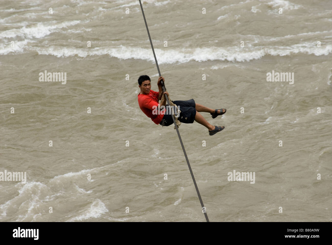 Lisu Minority Crossing Nu River, Yunnan, China. Stock Photo