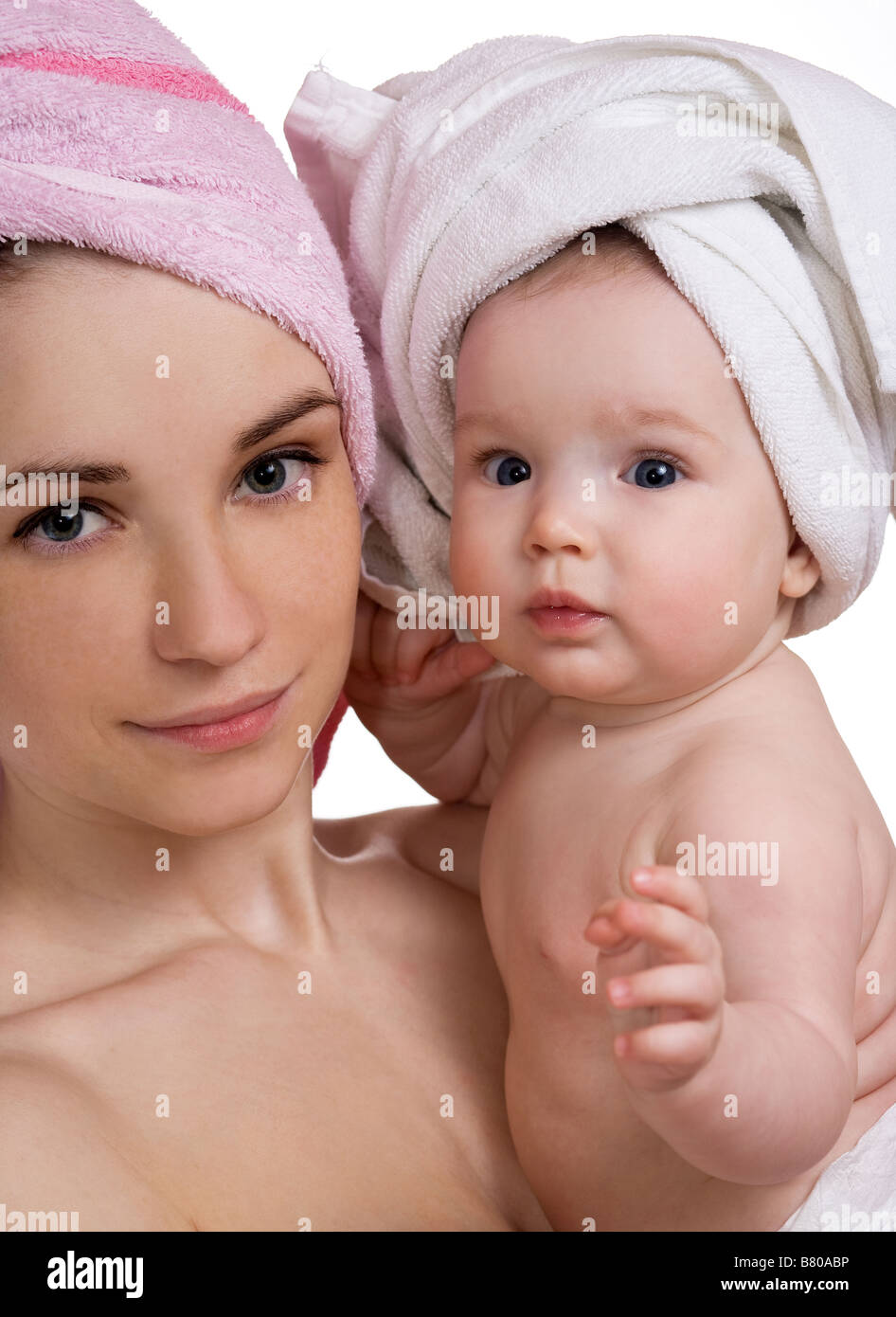 beautiful mother and daughter with a towel after a shower Stock Photo -  Alamy