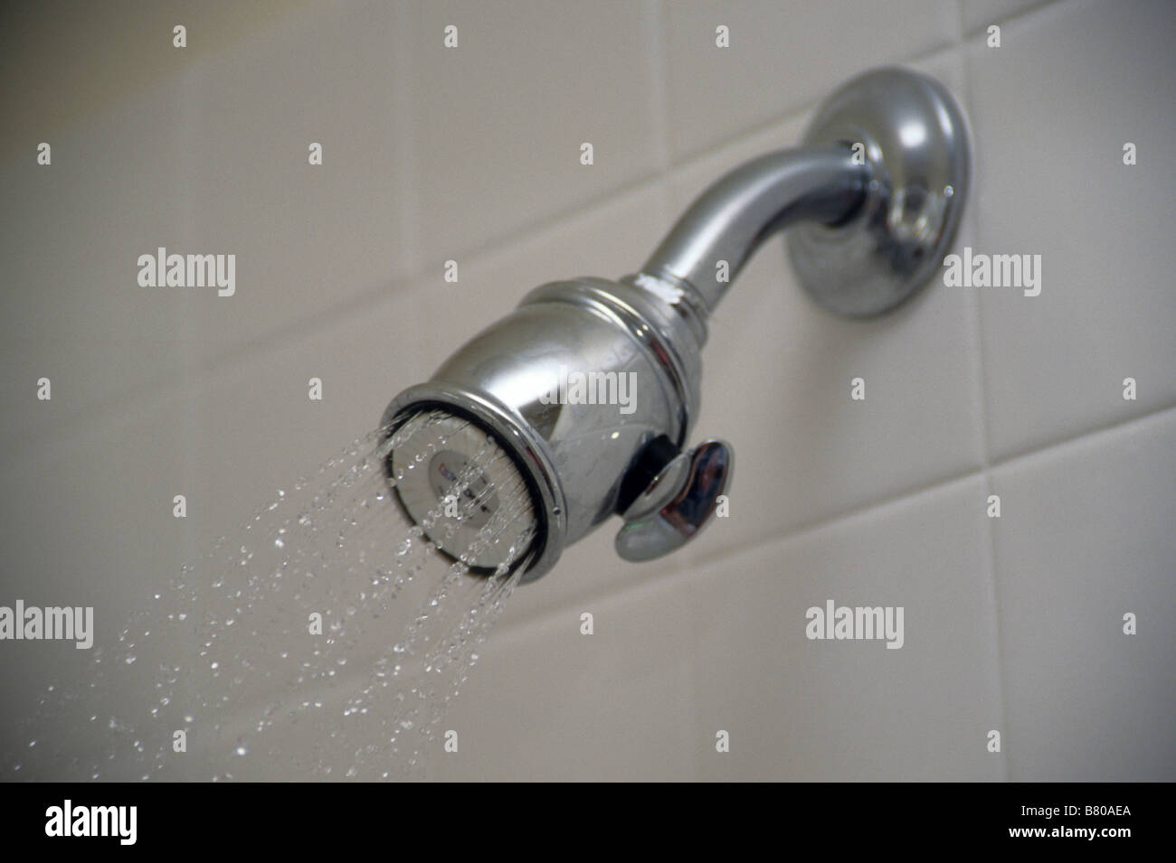 Chrome plated shower head waste water conserve adjust stream flow Stock Photo Alamy