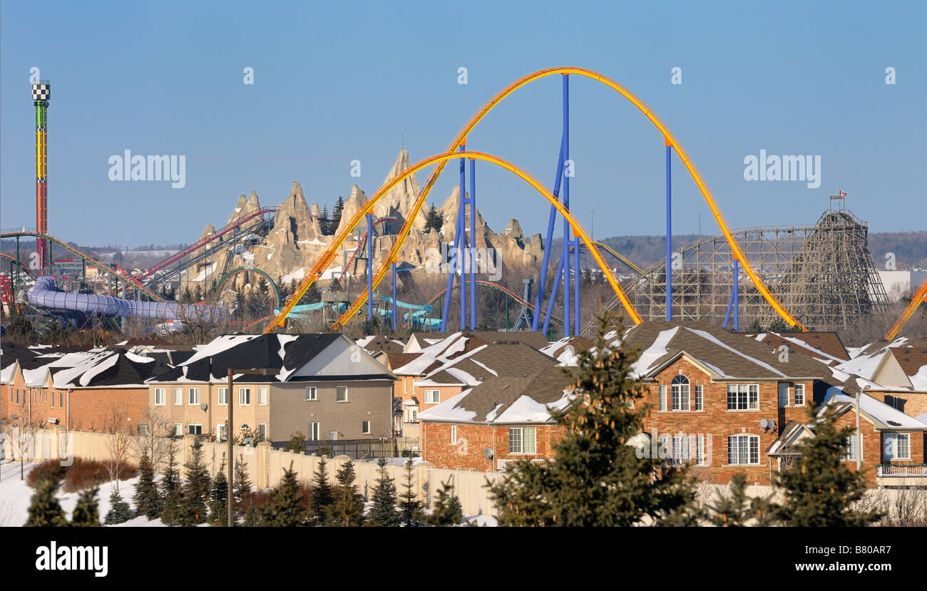 Closed amusement rides Wonderland roller coaster in winter next to a residential housing development near Toronto Stock Photo