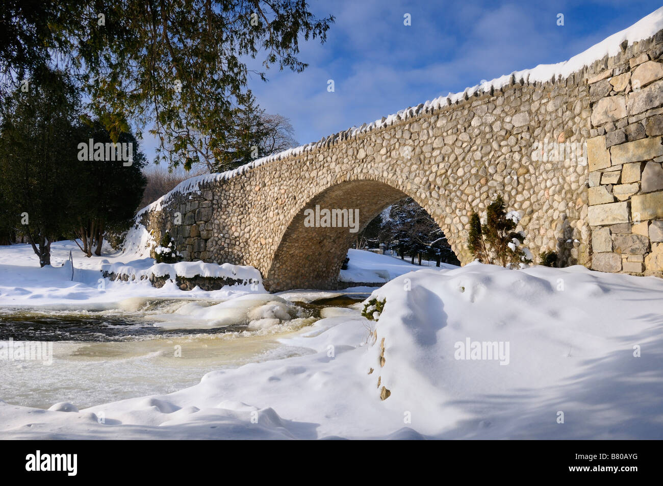 Spencer Creek flowing under a stone bridge at ster Falls