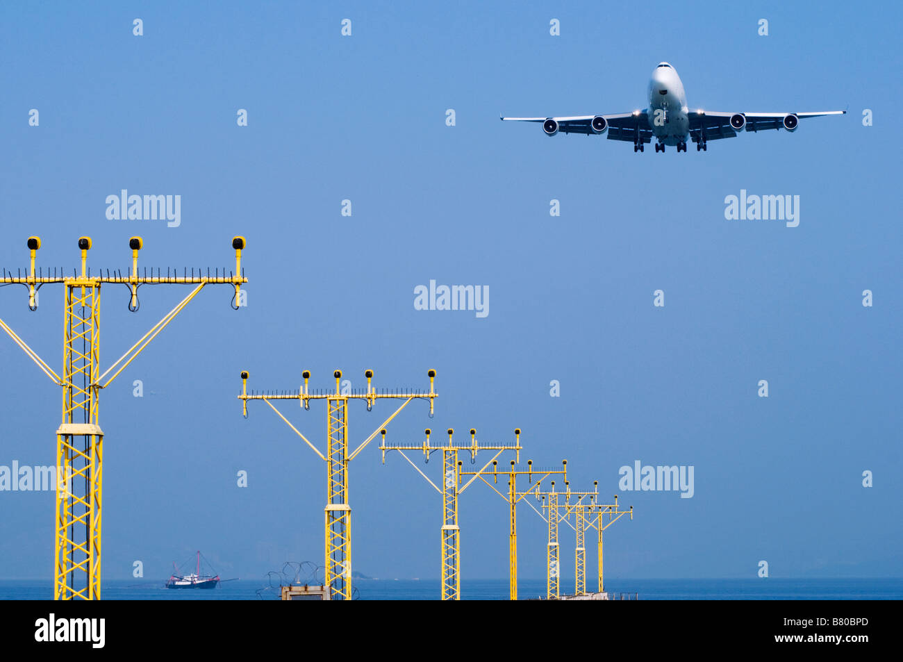 A cargo airplane landing at  Hong Kong Chek Lap Kok Airport. Stock Photo