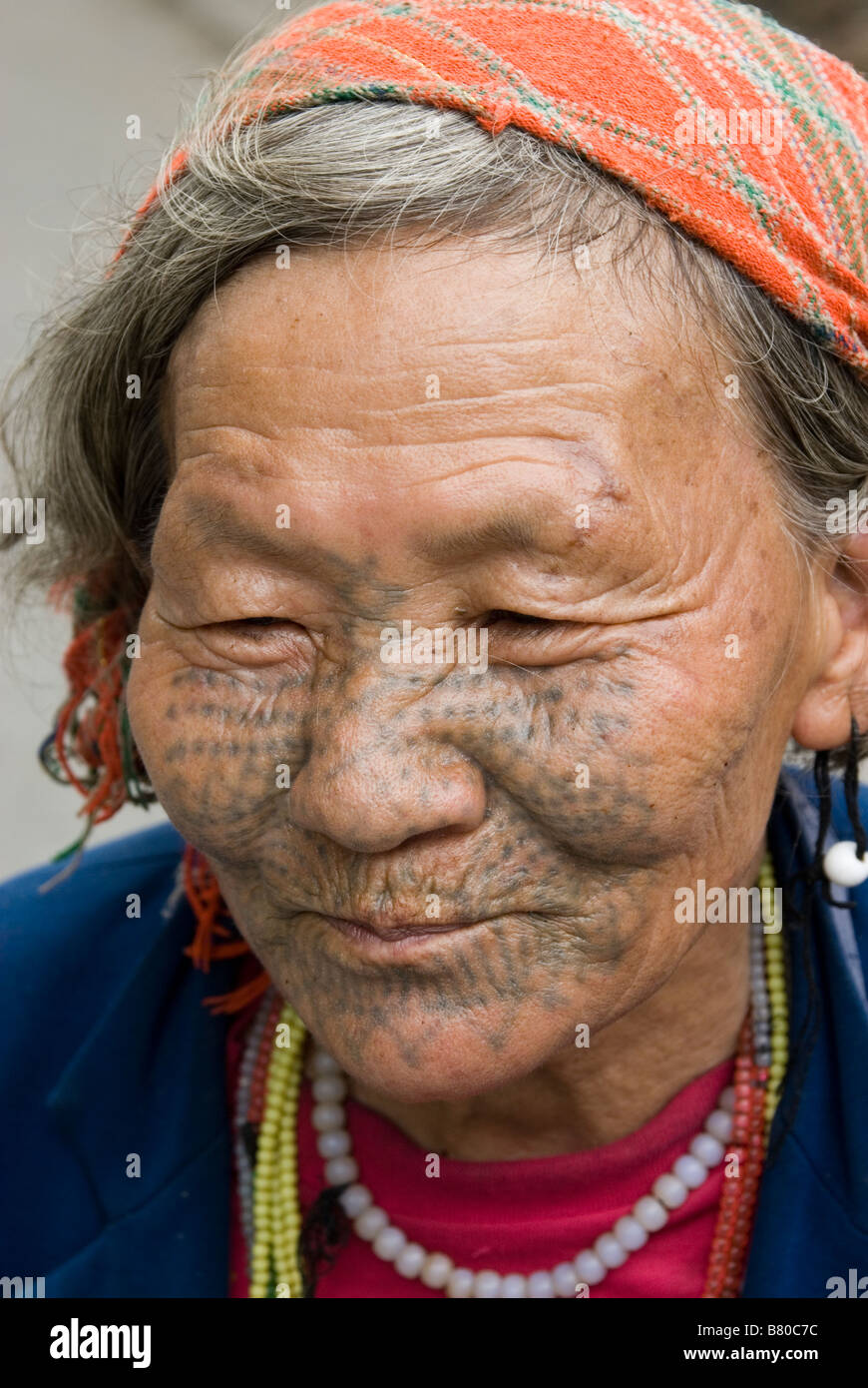 Old lady from Dulong minority people with traditional face tattoos, Yunnan  Province, China Stock Photo - Alamy