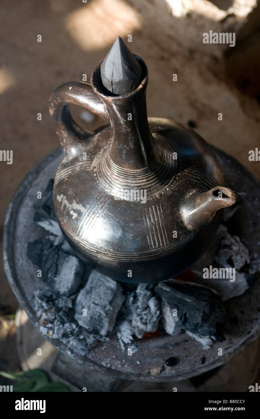 https://c8.alamy.com/comp/B80CCY/a-coffee-pot-on-coal-stove-omo-valley-ethiopia-africa-B80CCY.jpg