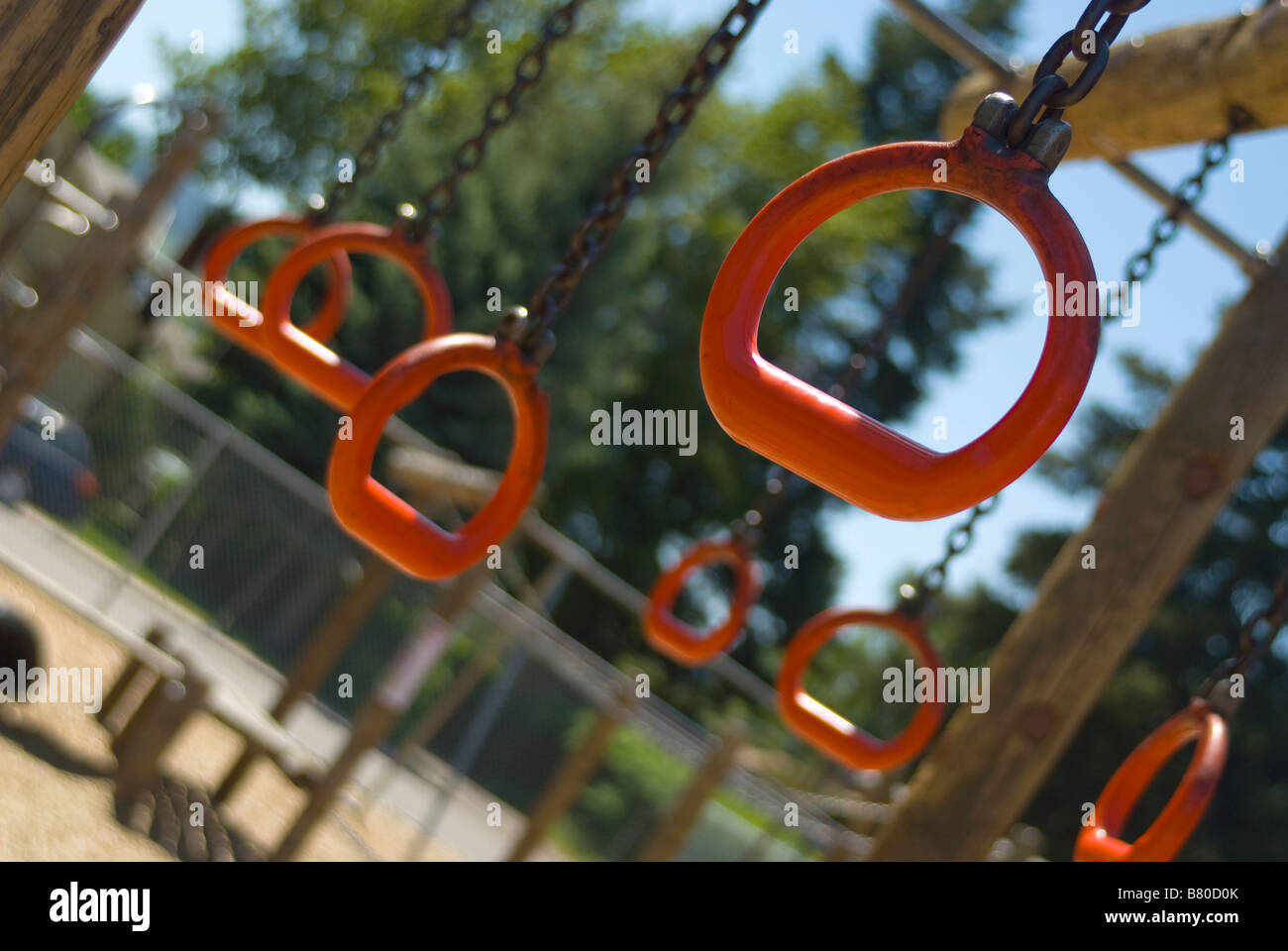 Athletics rings hanging on a playground in a school yard Stock Photo