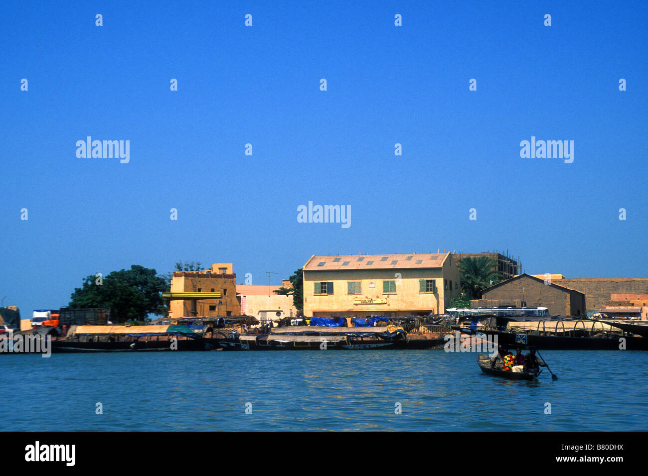 Small wooden boat crossing the port at Mopti Mali West Africa Stock Photo
