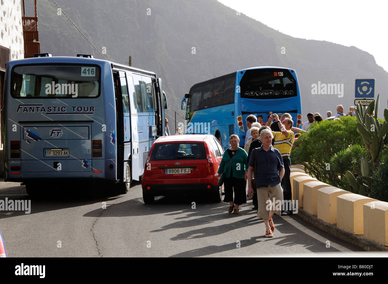 The small mountain village of Masca in the Teno massif Tenerife Canary Islands tourist buses hog the road Stock Photo
