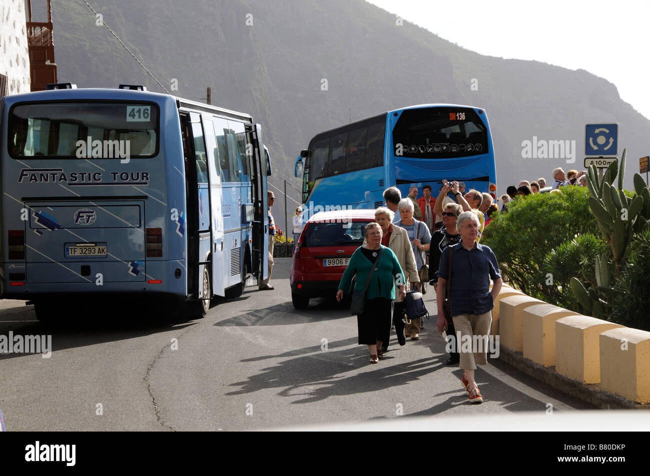 The small mountain village of Masca in the Teno massif Tenerife Canary Islands tourist buses hog the road Stock Photo