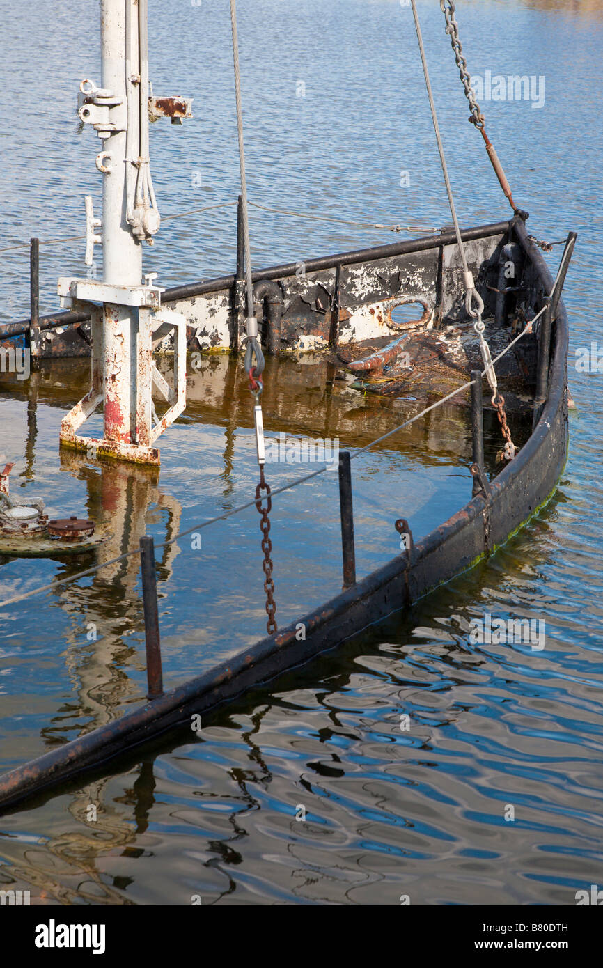 Sunken steel boat decoration in Lake Cherry in The Villages retirment community in Central Florida, USA Stock Photo