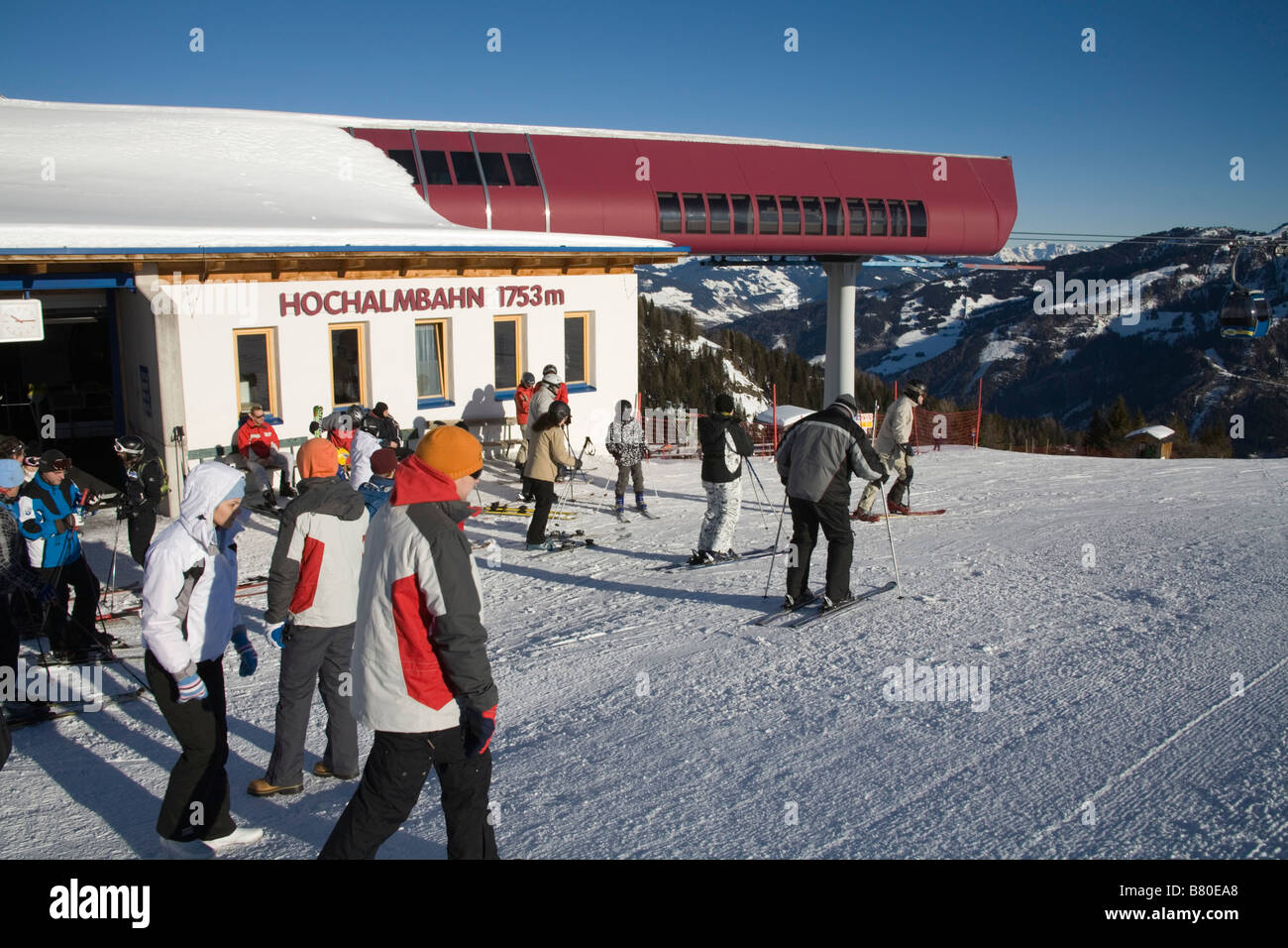 Rauris Austria EU January Skiers and walkers just arrived at the Hochalmbahn gondola station for the ski slopes Stock Photo