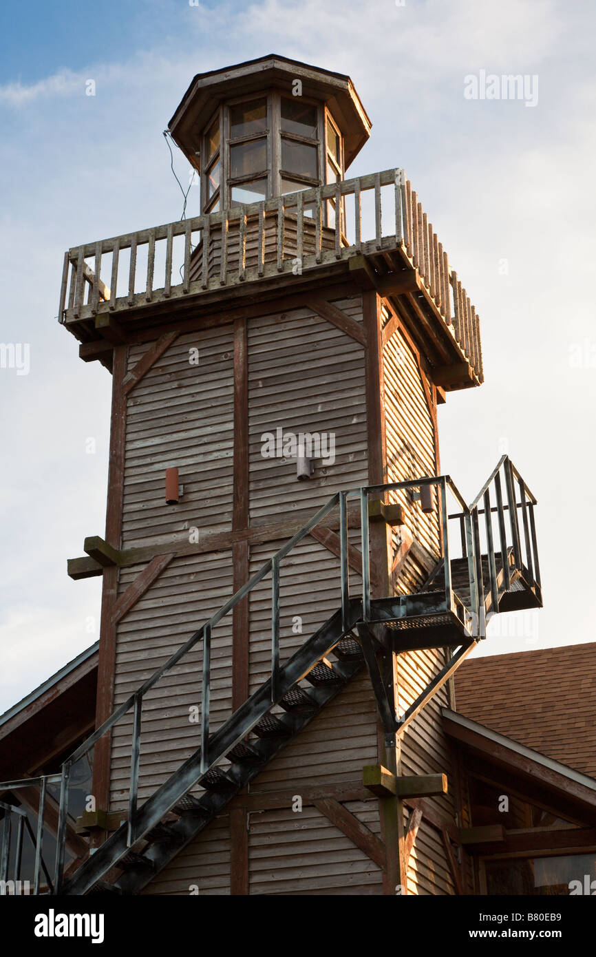 Lighthouse shaped tower at restaurant along coastline in Cedar Key, Florida, USA Stock Photo