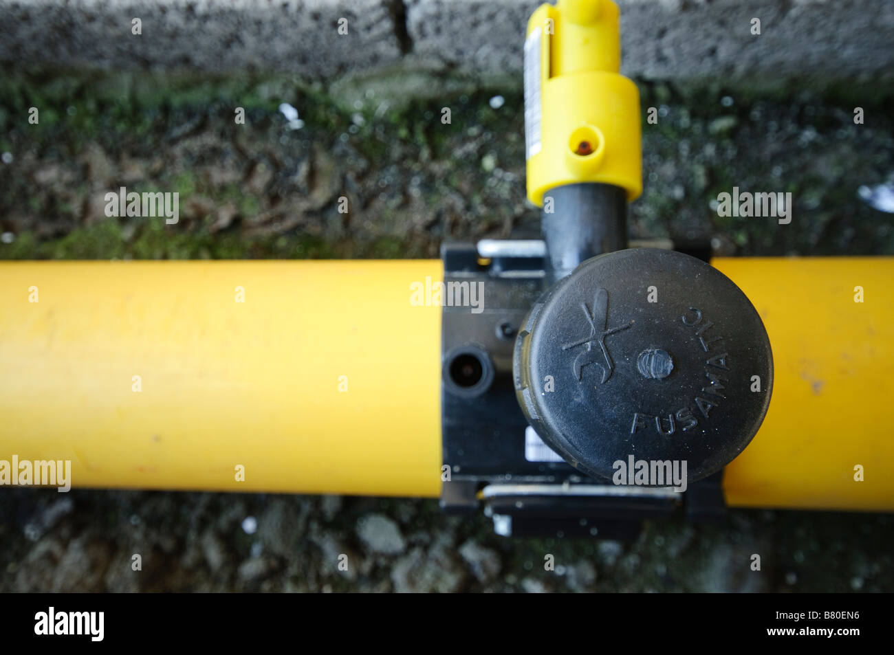 Junction of main gas pipe to tap off supply pipe. Stock Photo