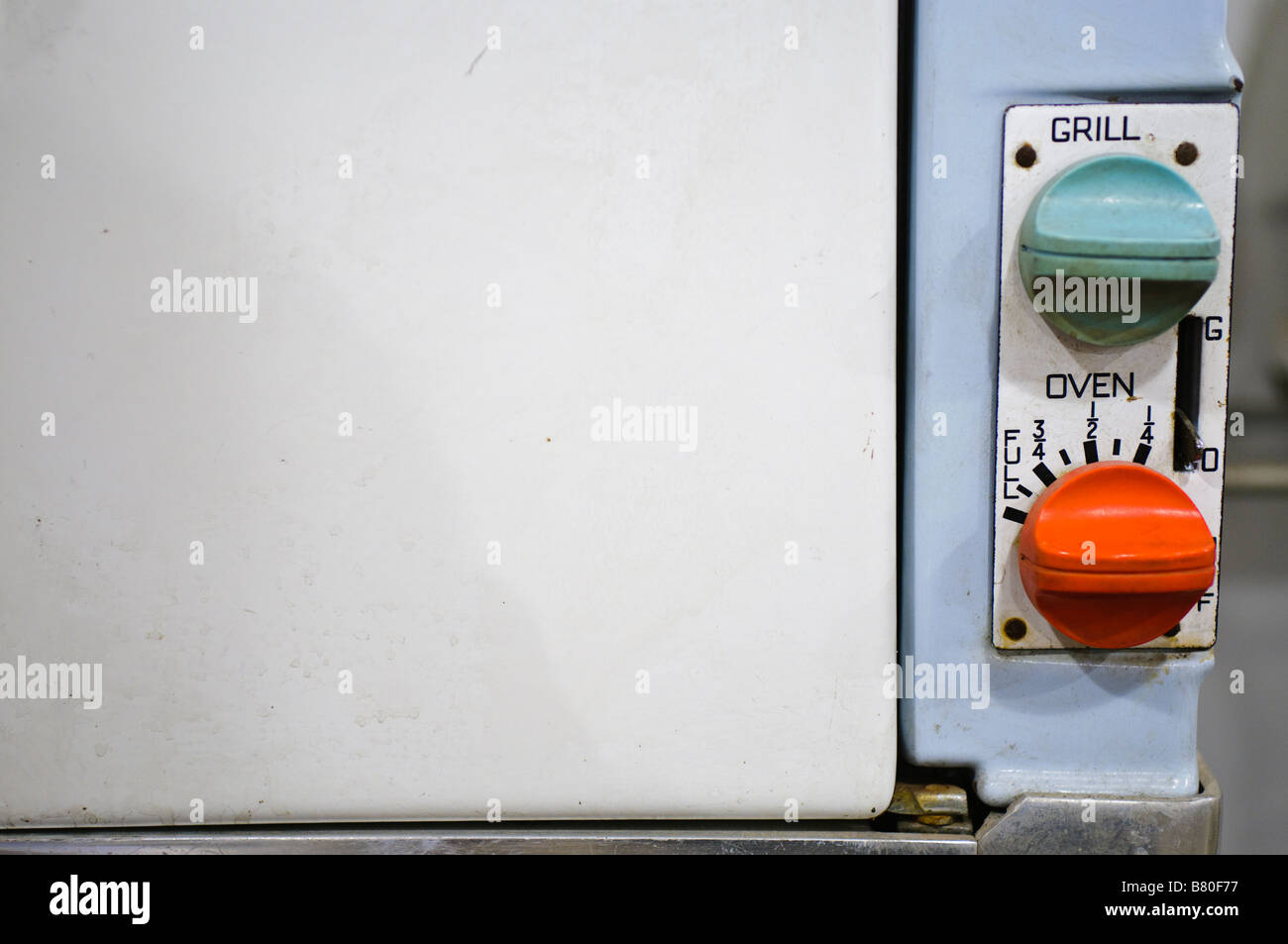 Detail of top of gas oven from 1960s showing oven and grill  knobs/switches Stock Photo