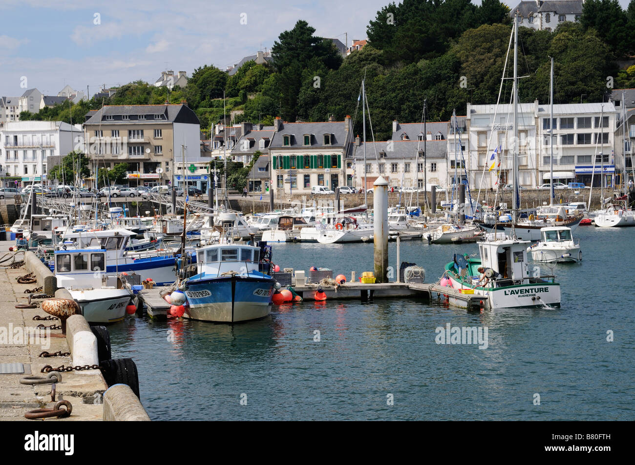 Fishing boats in pretty French harbour at Audierne in Brittany, France Stock Photo