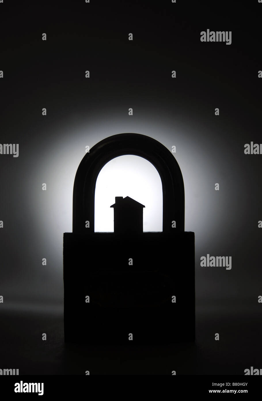 SMALL HOUSE PROTECTED BY PADLOCK Stock Photo