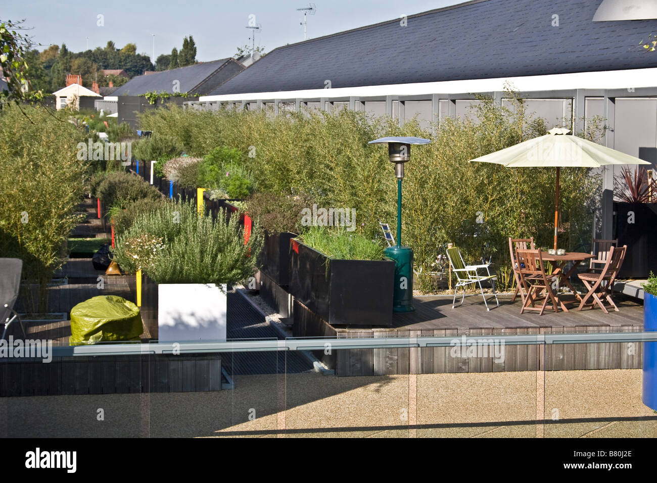 Refurbished terraced houses, Chimney Pot Park, Salford, Greater Manchester, UK. Rear, decked