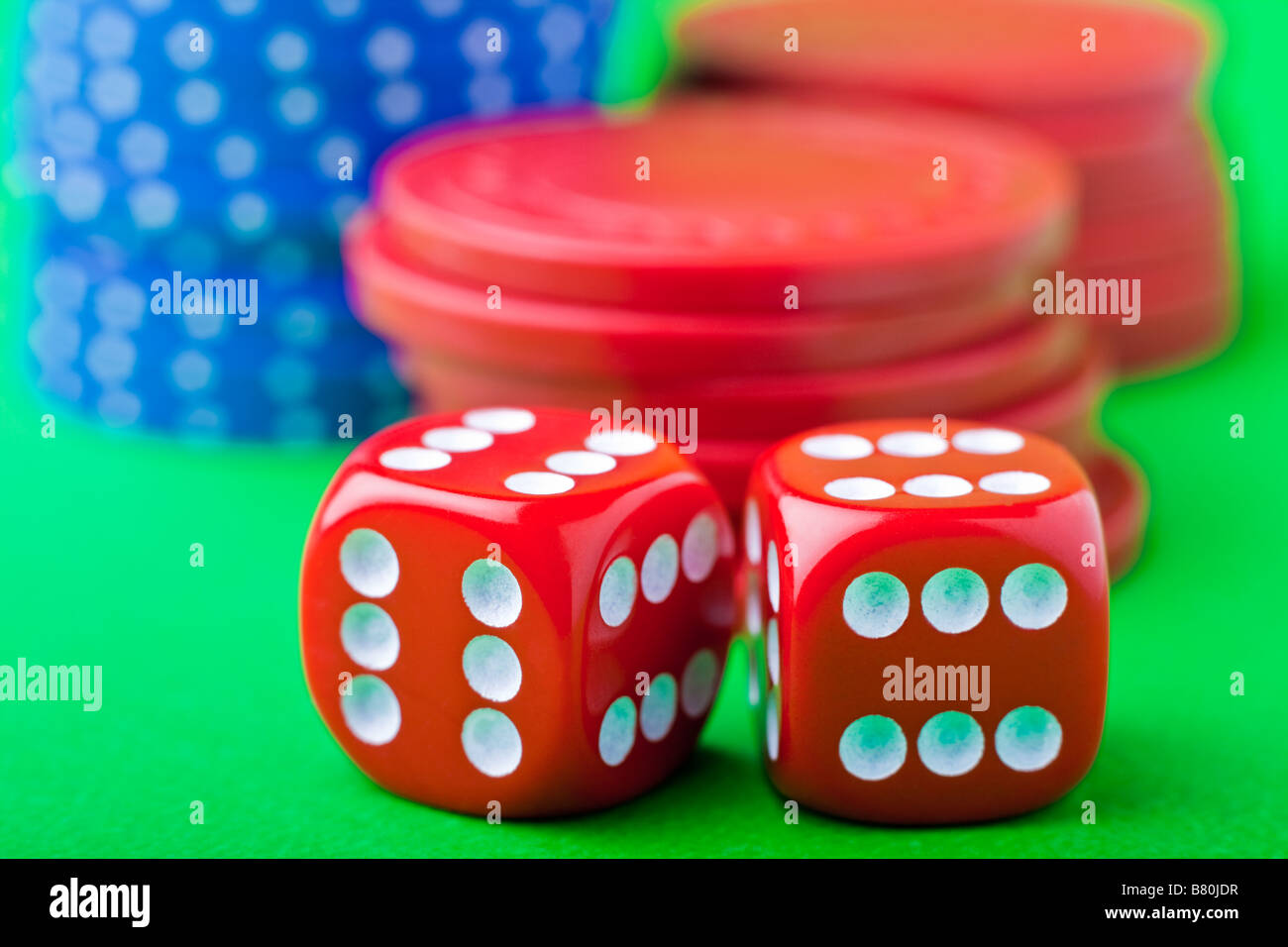 Crooked dice with sixes on all sides and poker chips Stock Photo Alamy