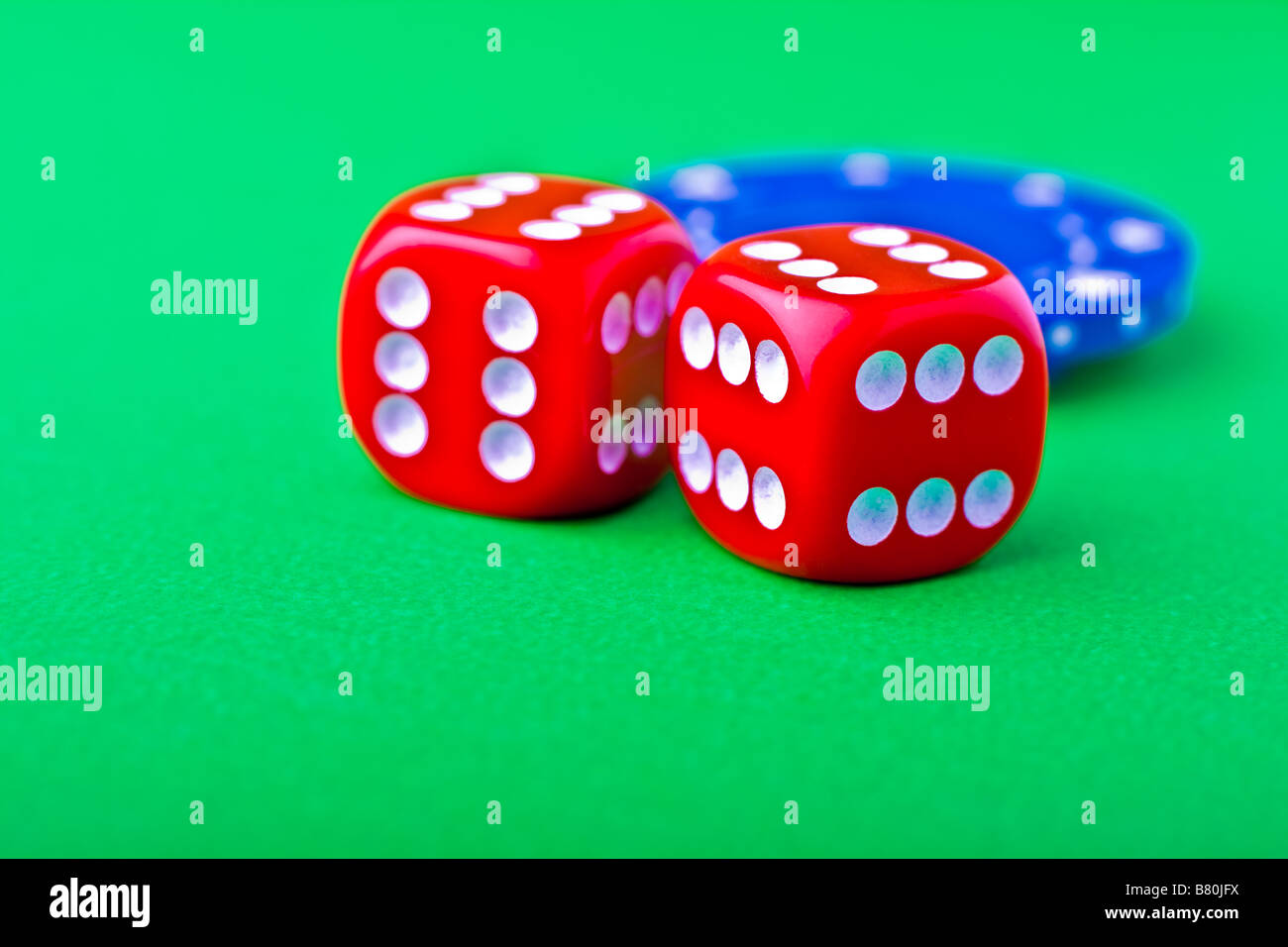 Crooked dice with sixes on all sides and poker chips Stock Photo Alamy