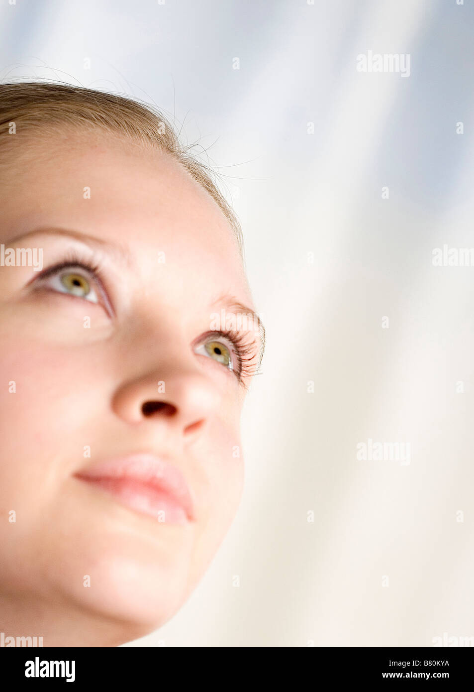 Close up to a young woman s face side view Stock Photo - Alamy