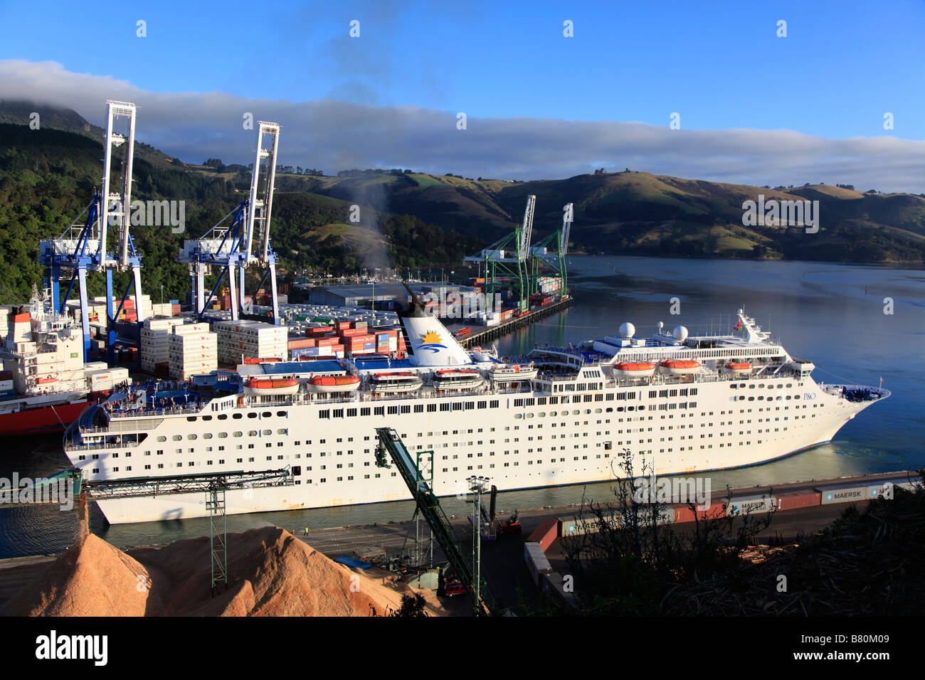 Pacific Sun cruise ship docking at container terminal,Port Chalmers, Otago Harbour, Dunedin, South Island, New Zealand Stock Photo