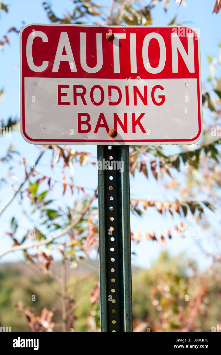 A sign that reads CAUTION ERODING BANK Shot in Vermont USA October 10 2008 Stock Photo