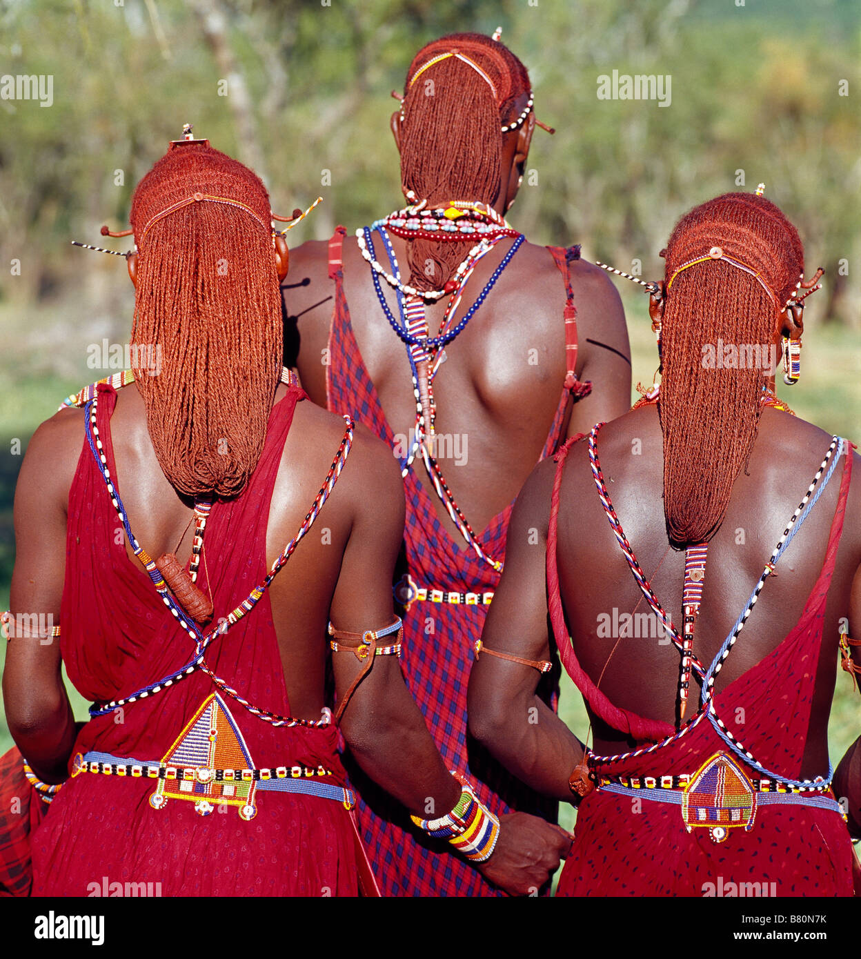 Kenya, Kajiado District, Ol doinyo Orok. Three Maasai warriors with ochred hair wearing the traditional warriors beaded belts Stock Photo