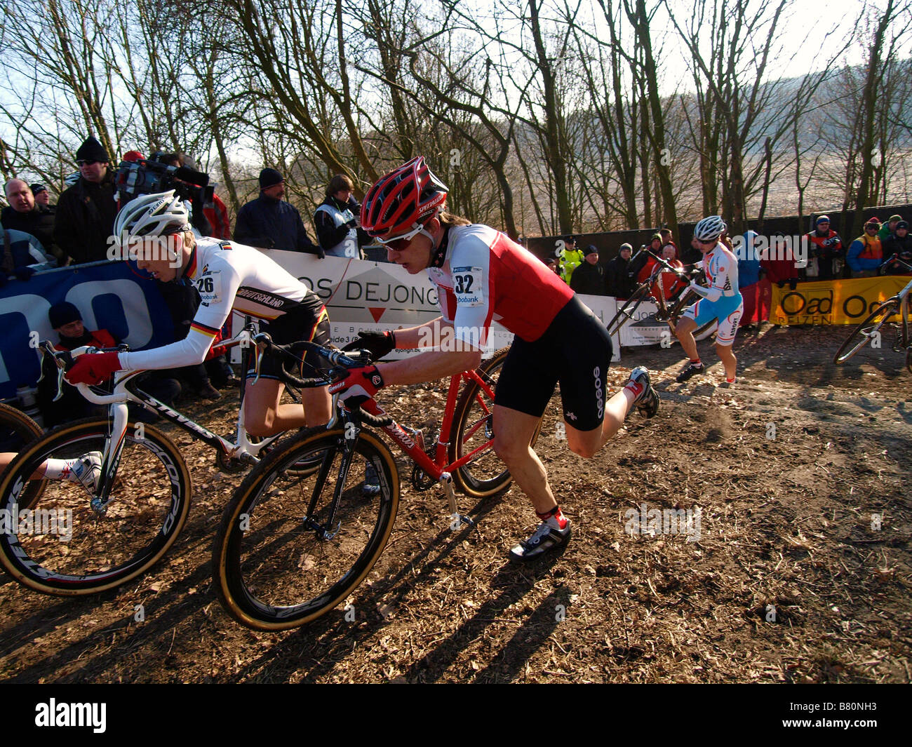 Participants in the worldchampionship cyclecross running up the stairs with their bicycles Hoogerheide the Netherlands Stock Photo