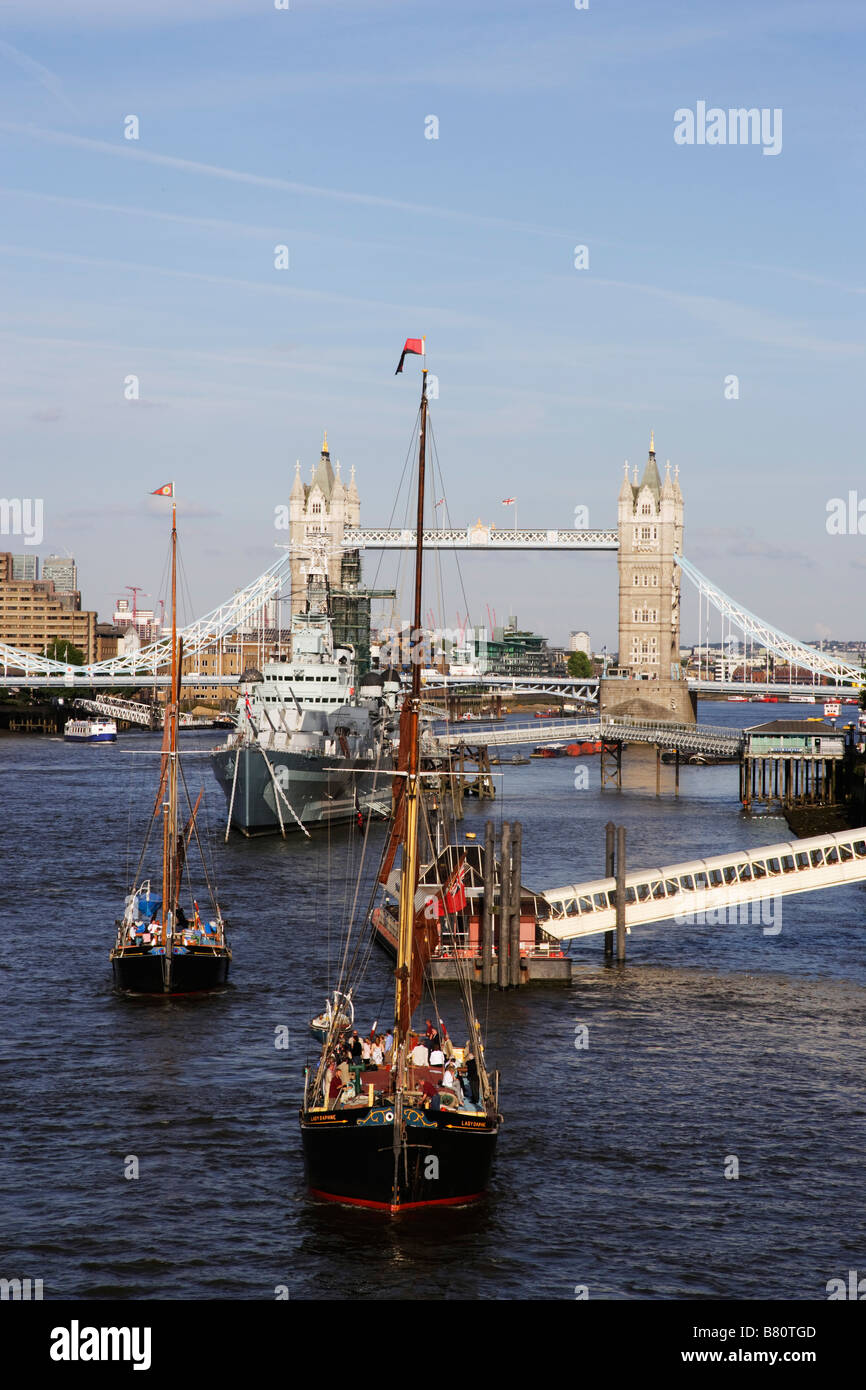 HMS Belfast on river Thames with Tower Bridge in background London London England United Kingdom Stock Photo