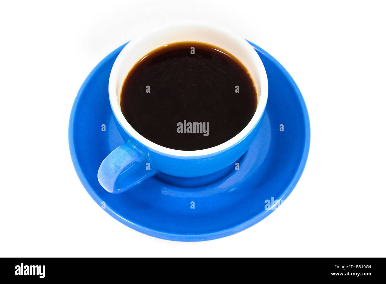 Cup of black coffee in a bright blue cup and saucer on a white