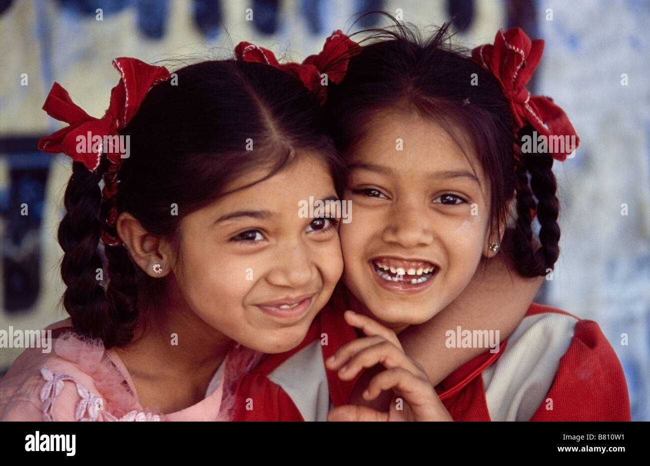 Two cheeky Indian school girls Stock Photo