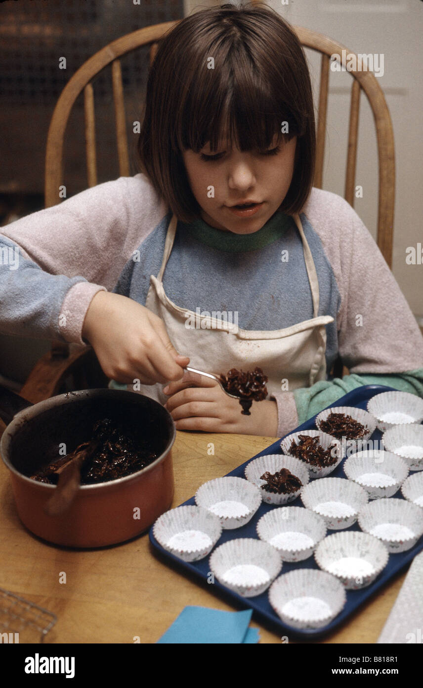 young girl baking chocolate confectionary Stock Photo Alamy