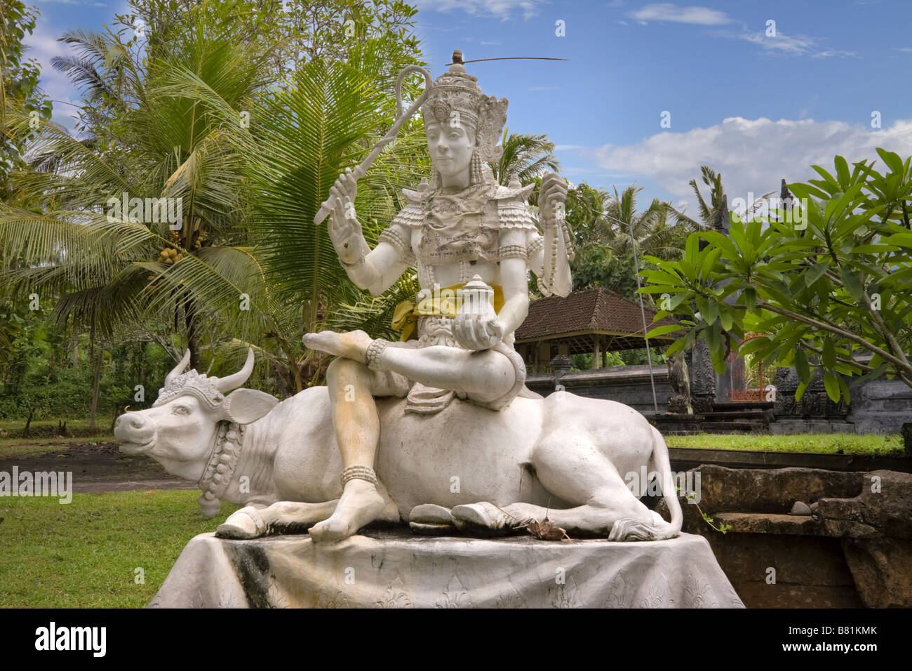 Statue of the Balinese Hindu deity Siwa sitting on the bull Nandi at the village temple of Pura Dalem, Desa Pekutatan, Bali Stock Photo