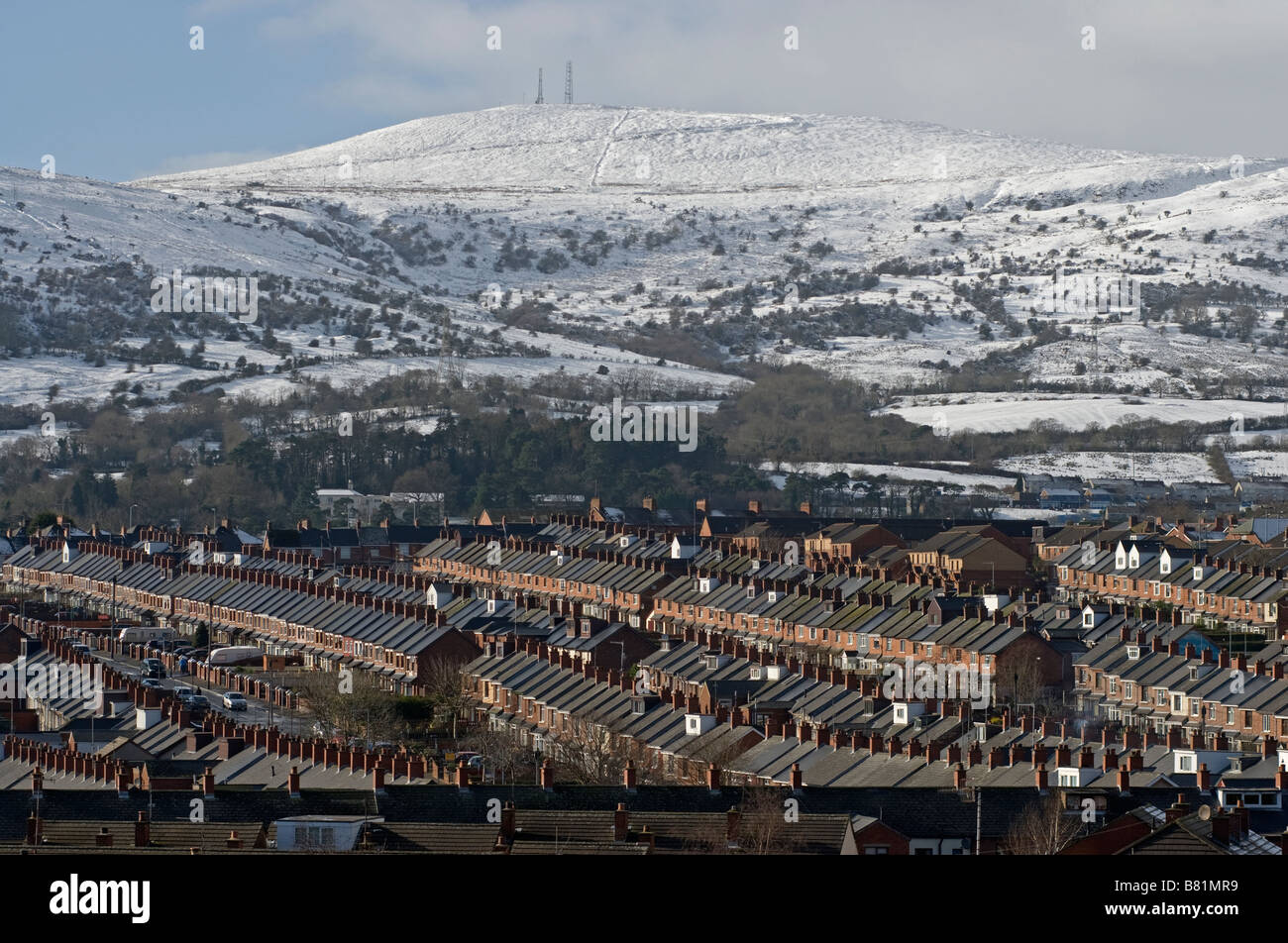 Terraced streets of the Ardoyne beneath the Divis Mountain, North Belfast. Stock Photo