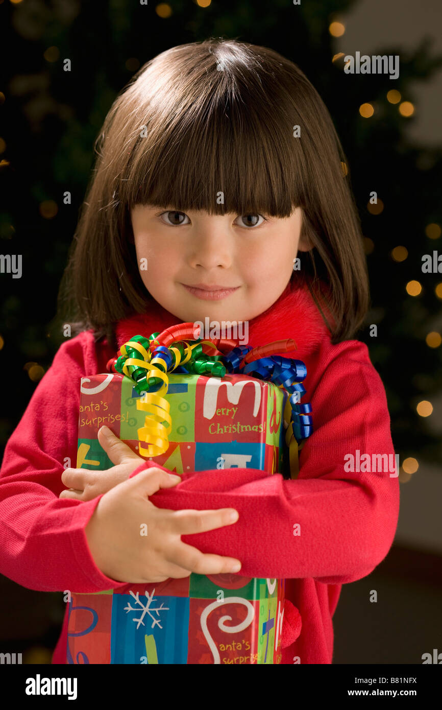 Little girl holding present Stock Photo - Alamy