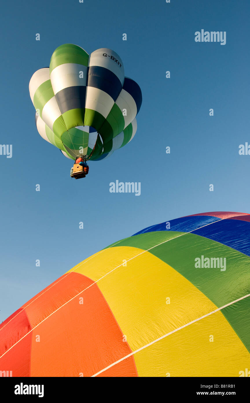 Colourful hot air balloons taking off against a bright blue sky Stock ...