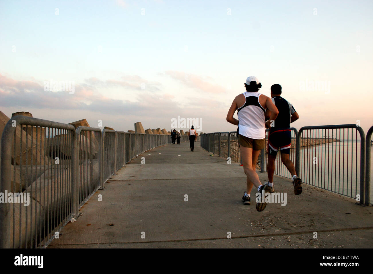 Israel Tel Aviv The old port Running on the Jetty Stock Photo - Alamy