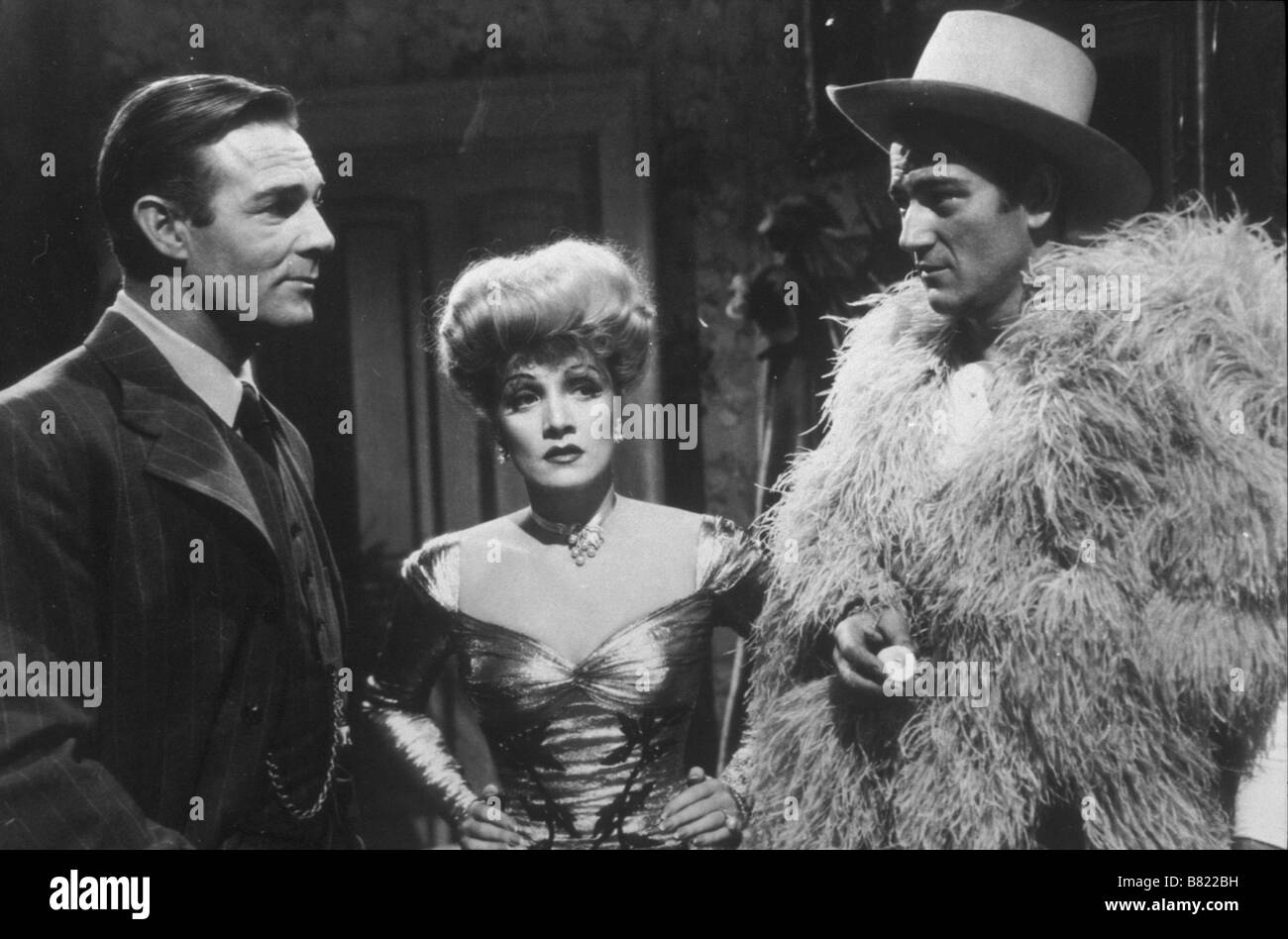 The Spoilers Year: 1942 USA Director: Ray Enright Marlene Dietrich, Randolph Scott, John Wayne Stock Photo