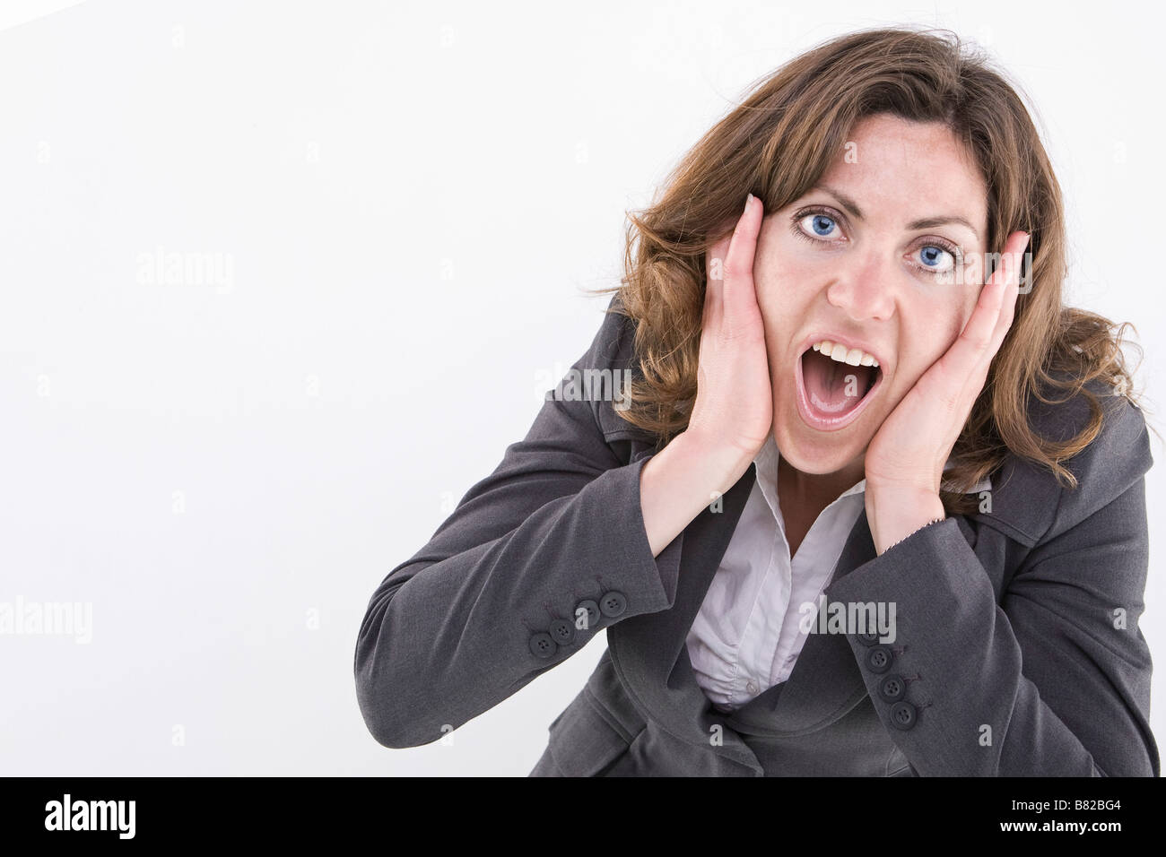 Surprised business woman Stock Photo - Alamy