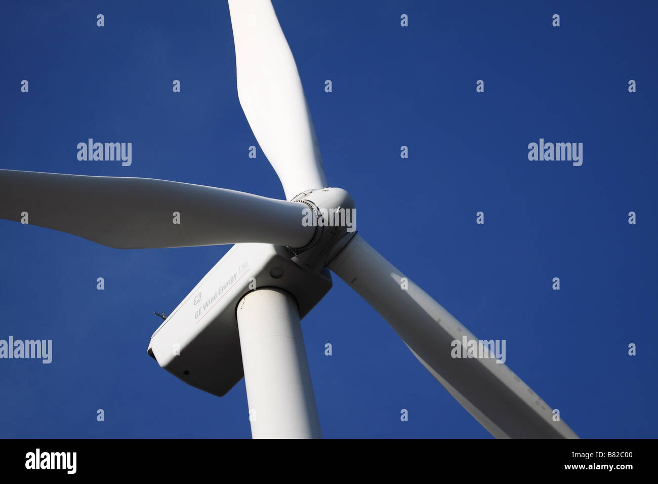 Blades of wind turbine with blue sky behind Stock Photo Alamy