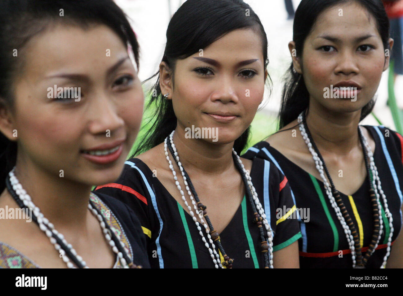 Three Khmer (Cambodian) ladies in traditional dress, photographed at the Cambodian Cultural Village Stock Photo