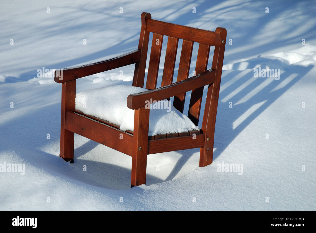 Garden chair covered in snow Stock Photo