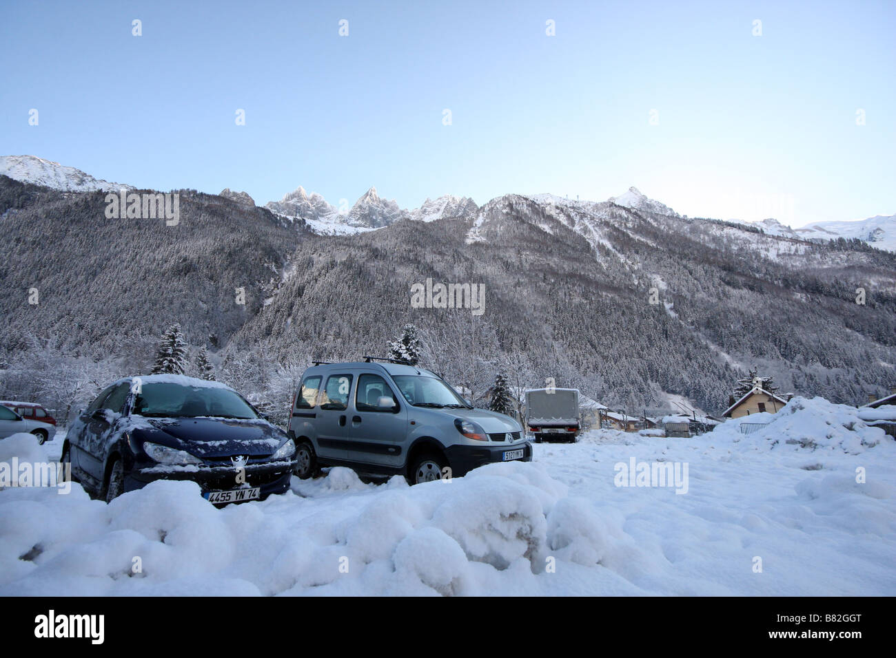 Cars parked behind a pile of snow in Chamonix Mont Blanc, France, the