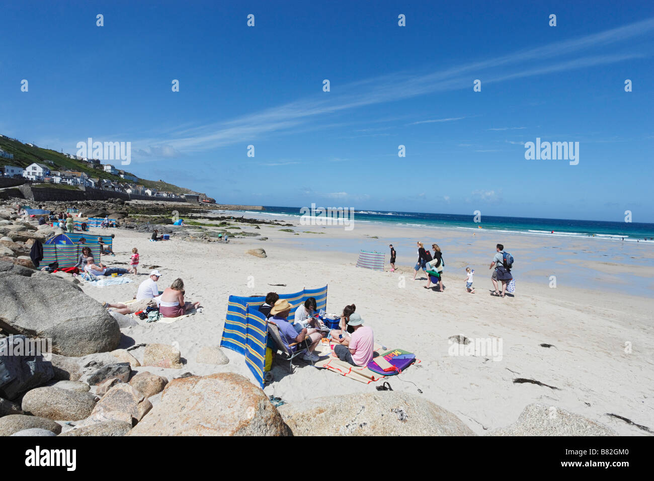 People relaxing at Sennen Cove Penwith peninsula Cornwall England United Kingdom Stock Photo