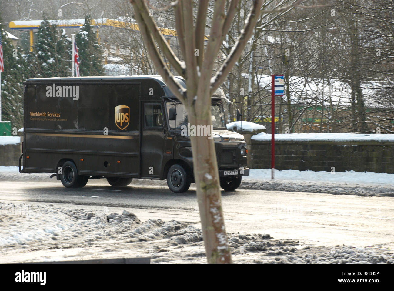 UPS delivery van on snowy road Stock Photo