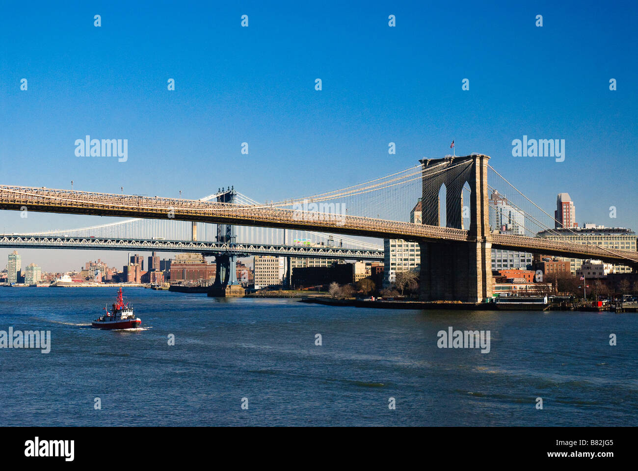 Brooklyn Bridge in a weak winter sunshine photo from pier 17 at